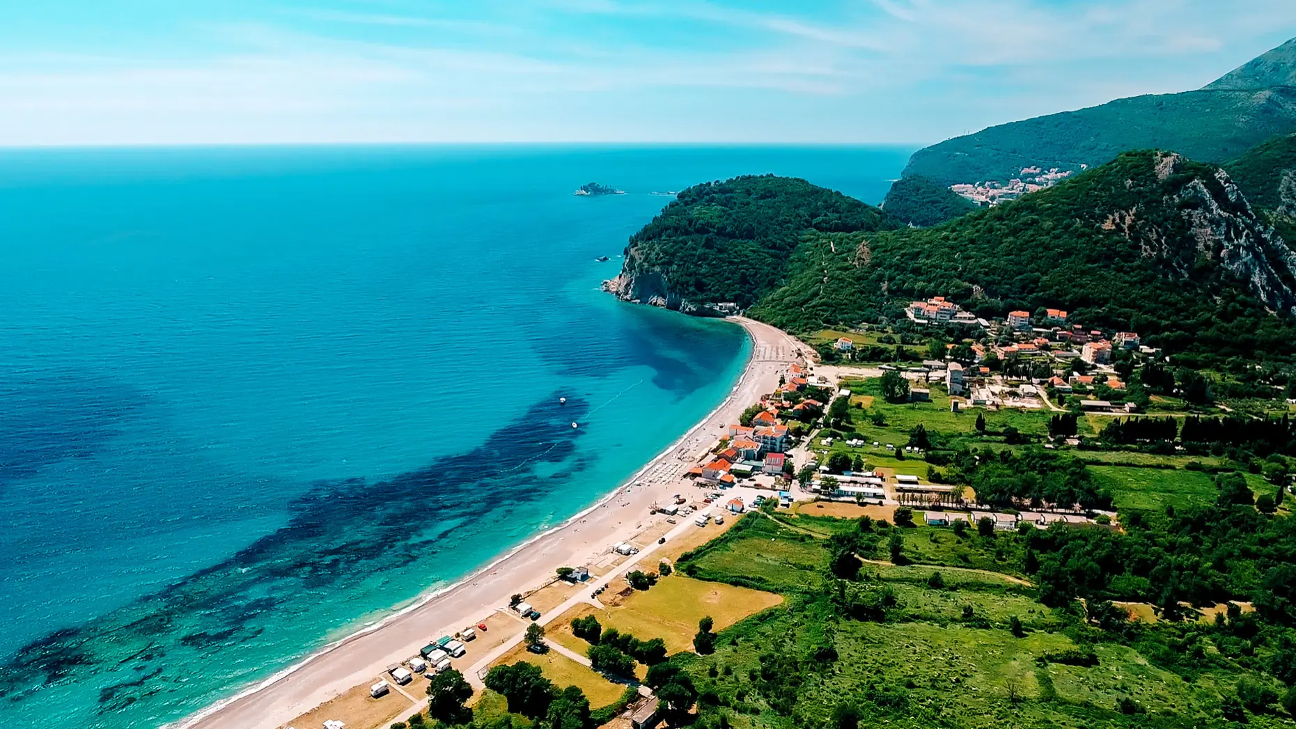 Buljarica beach curving along the wooded Adriatic coast south of Petrovac