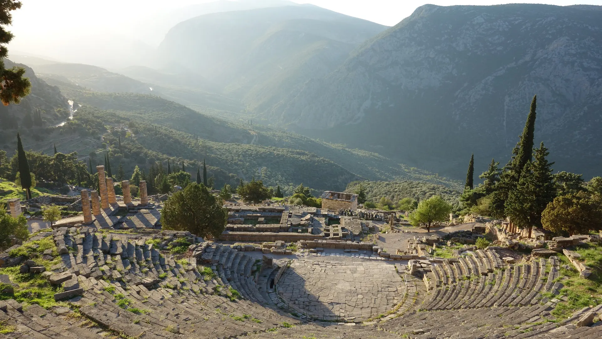 Delphi's ancient theatre overlooking the green Pleistos valley and surrounding mountains