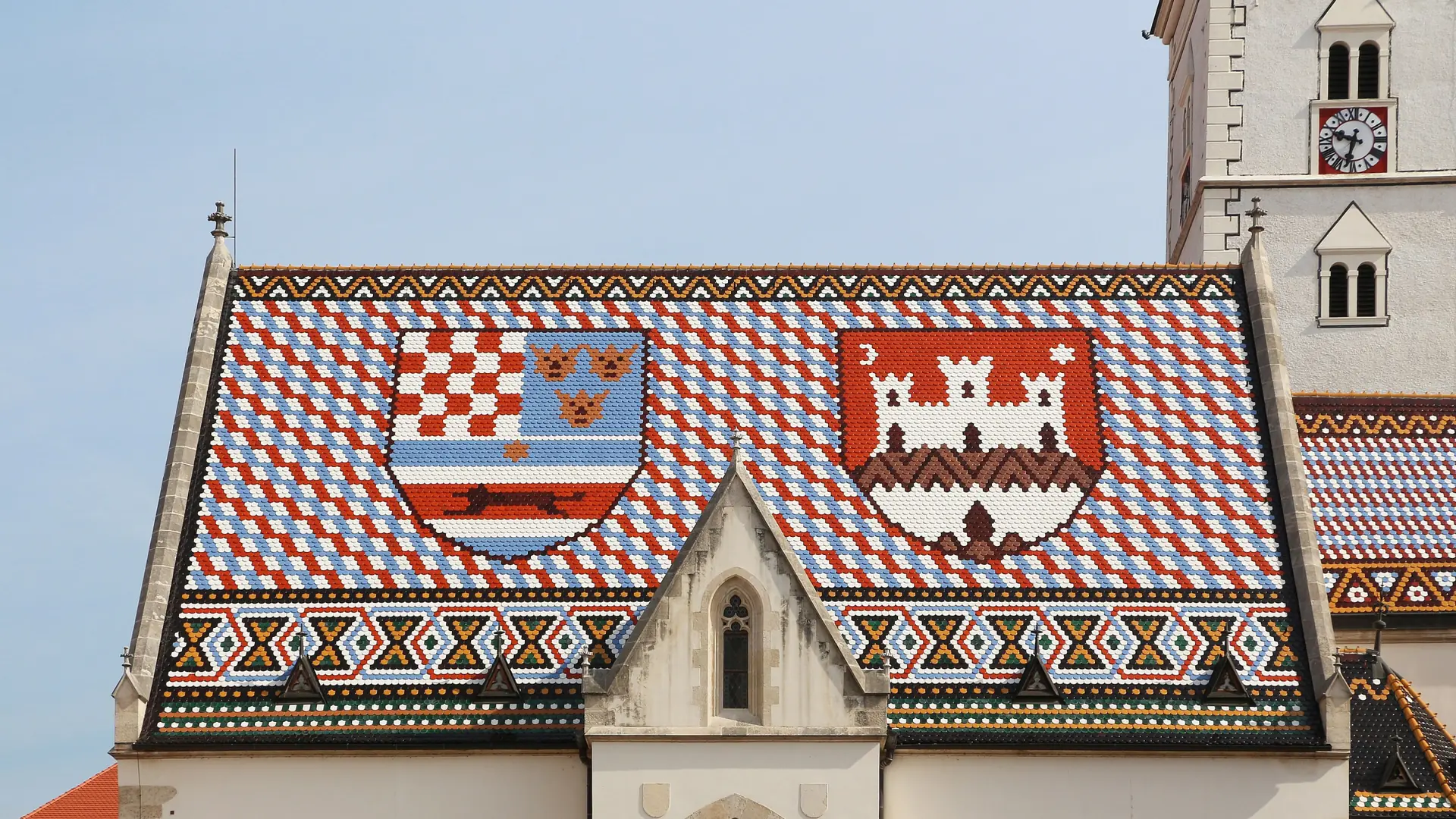 St Mark's Church and its patterned tiled roof beneath a blue Zagreb sky