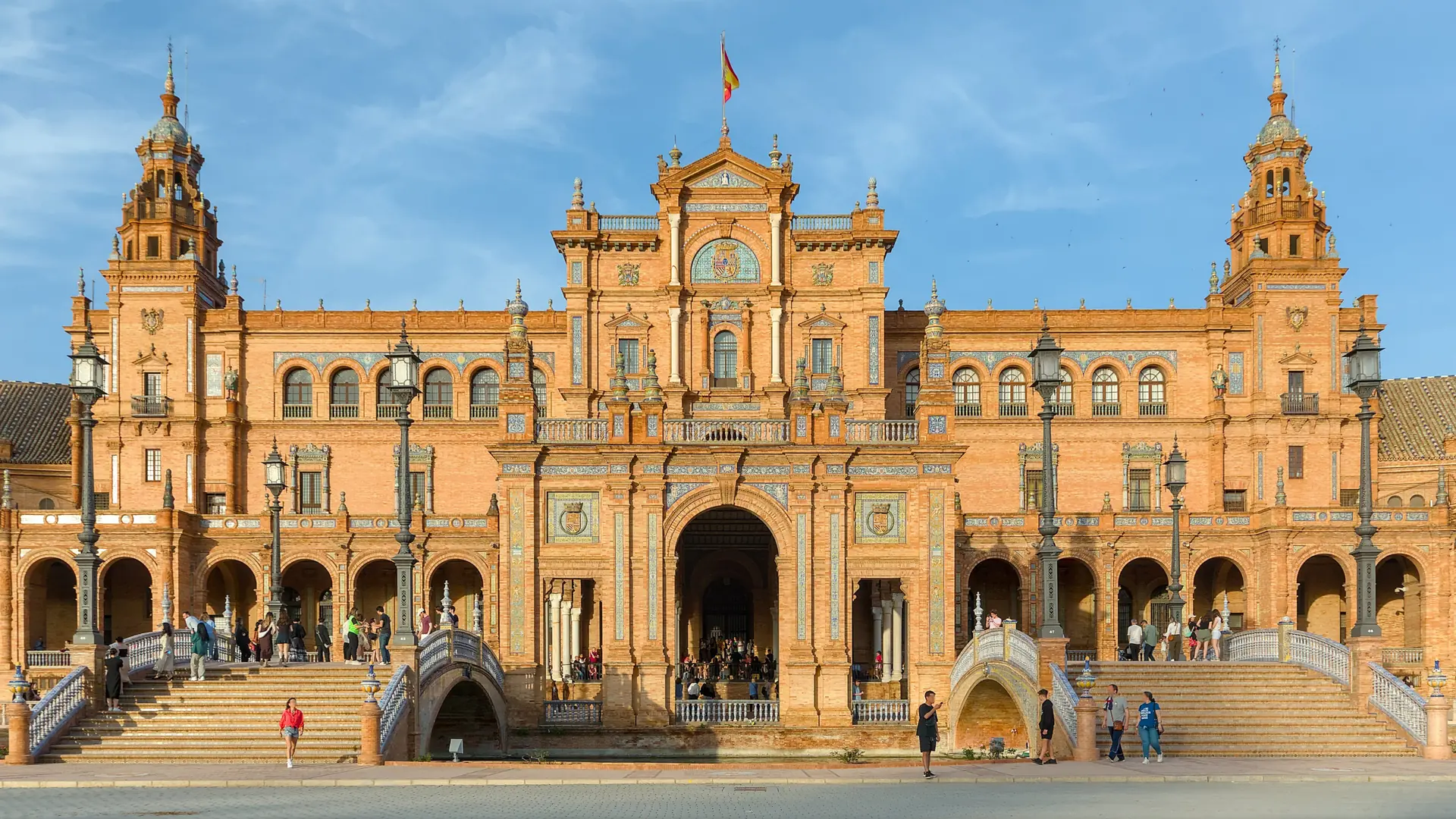 Bright frontal view of Plaza de España's ornate central pavilion in Seville