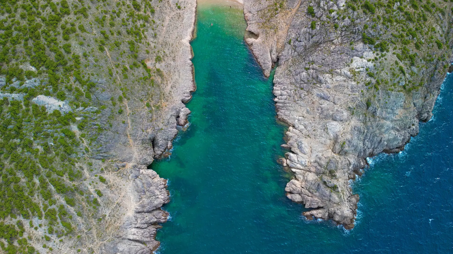 Clear turquoise water beside a quiet rocky cove on the Croatian Adriatic coast