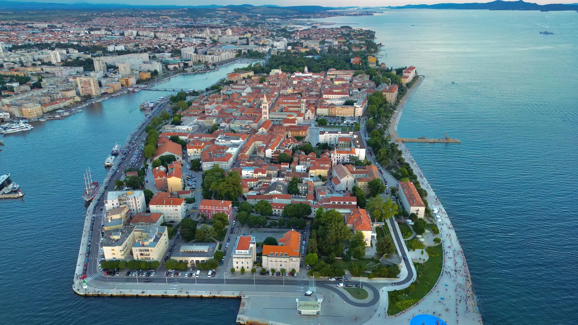 Poreč old town peninsula reaching into blue Adriatic water on a clear summer morning
