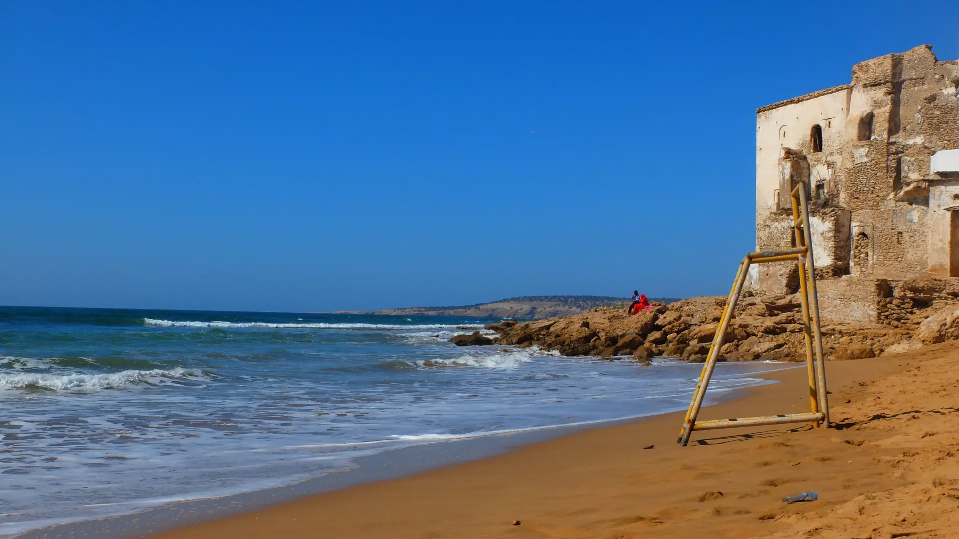 Bright Atlantic surf and broad beach at Sidi Kaouki south of Essaouira