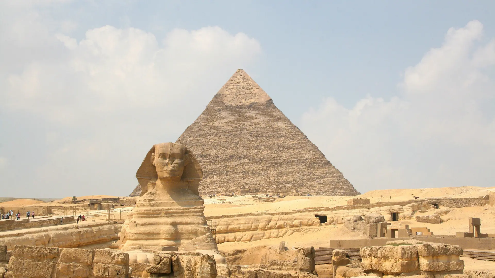 The Great Sphinx in sunlight with Khafre’s pyramid behind it on the Giza Plateau.