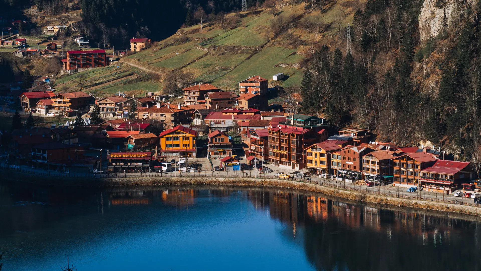 Uzungöl village and lake ringed by steep green mountains in Trabzon province