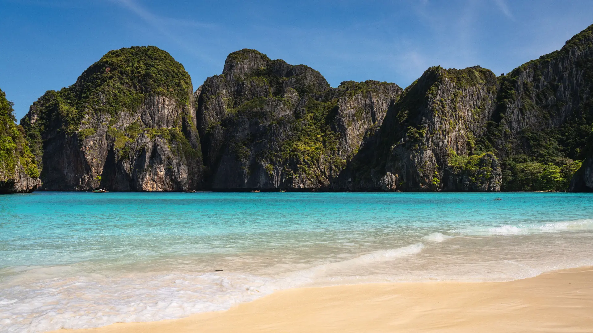 Turquoise water enclosed by the limestone cliffs of Maya Bay in the Phi Phi Islands