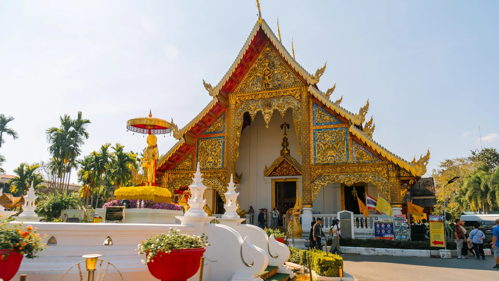 Flower garlands surrounding a gilded temple in Chiang Mai