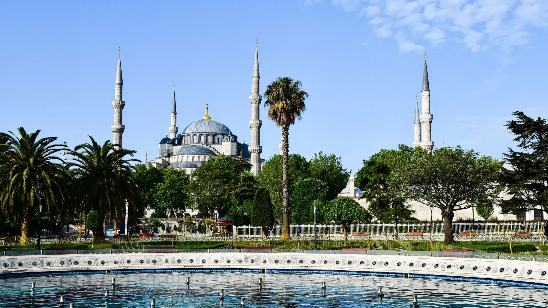 Sunny Sultanahmet square framed by the Blue Mosque and historic domes