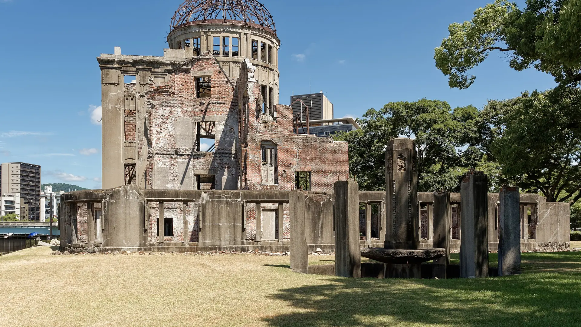 Hiroshima’s Atomic Bomb Dome and brick ruins beneath a clear blue sky