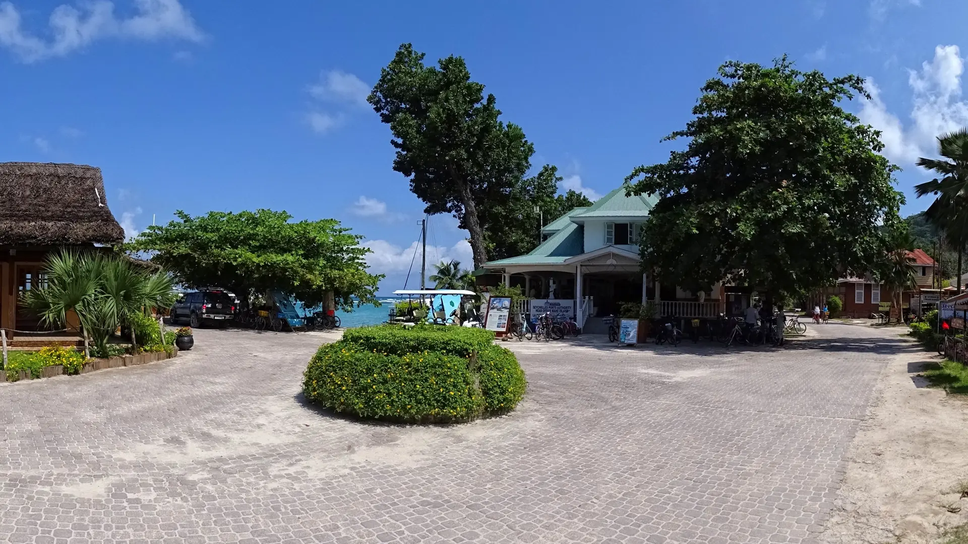 Sunny village roundabout near the La Passe ferry terminal on La Digue
