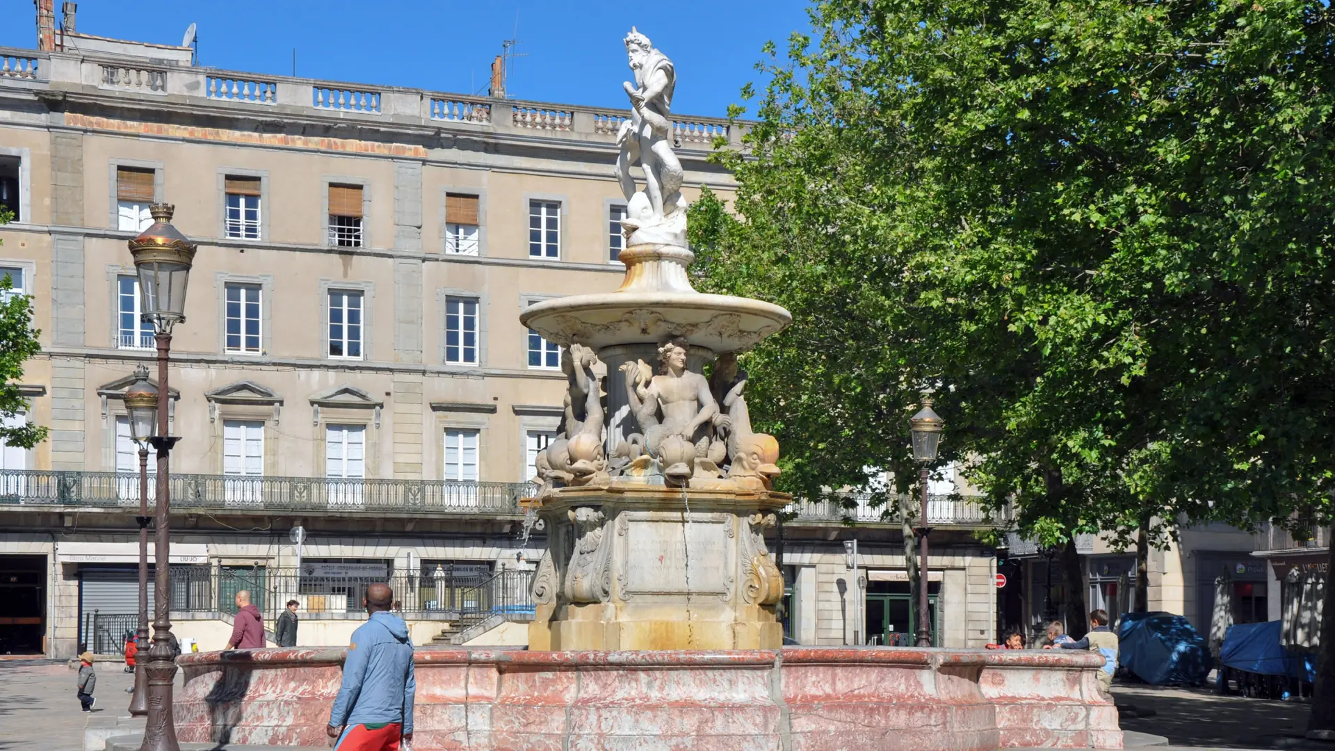 Neptune fountain and surrounding façades on Place Carnot in Carcassonne