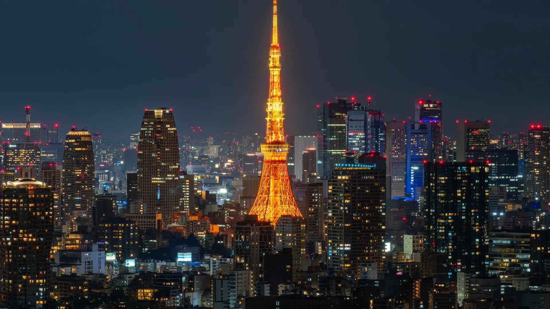 Tokyo skyline and river bridges shining at blue hour