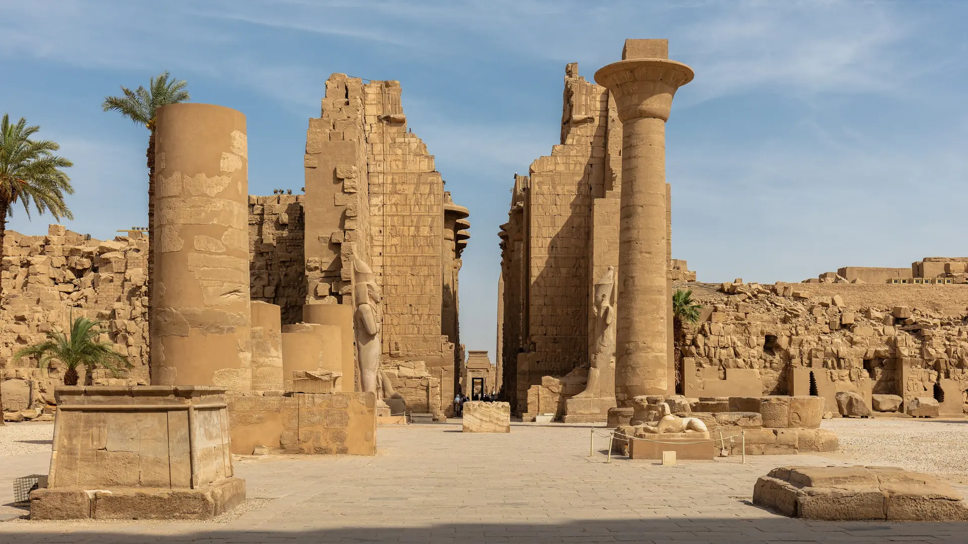 Sunlit columns and open court at Karnak Temple in Luxor