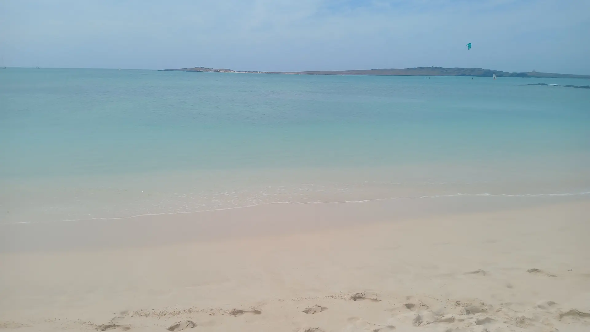 Pale sand and clear water at Praia de Estoril on Boa Vista