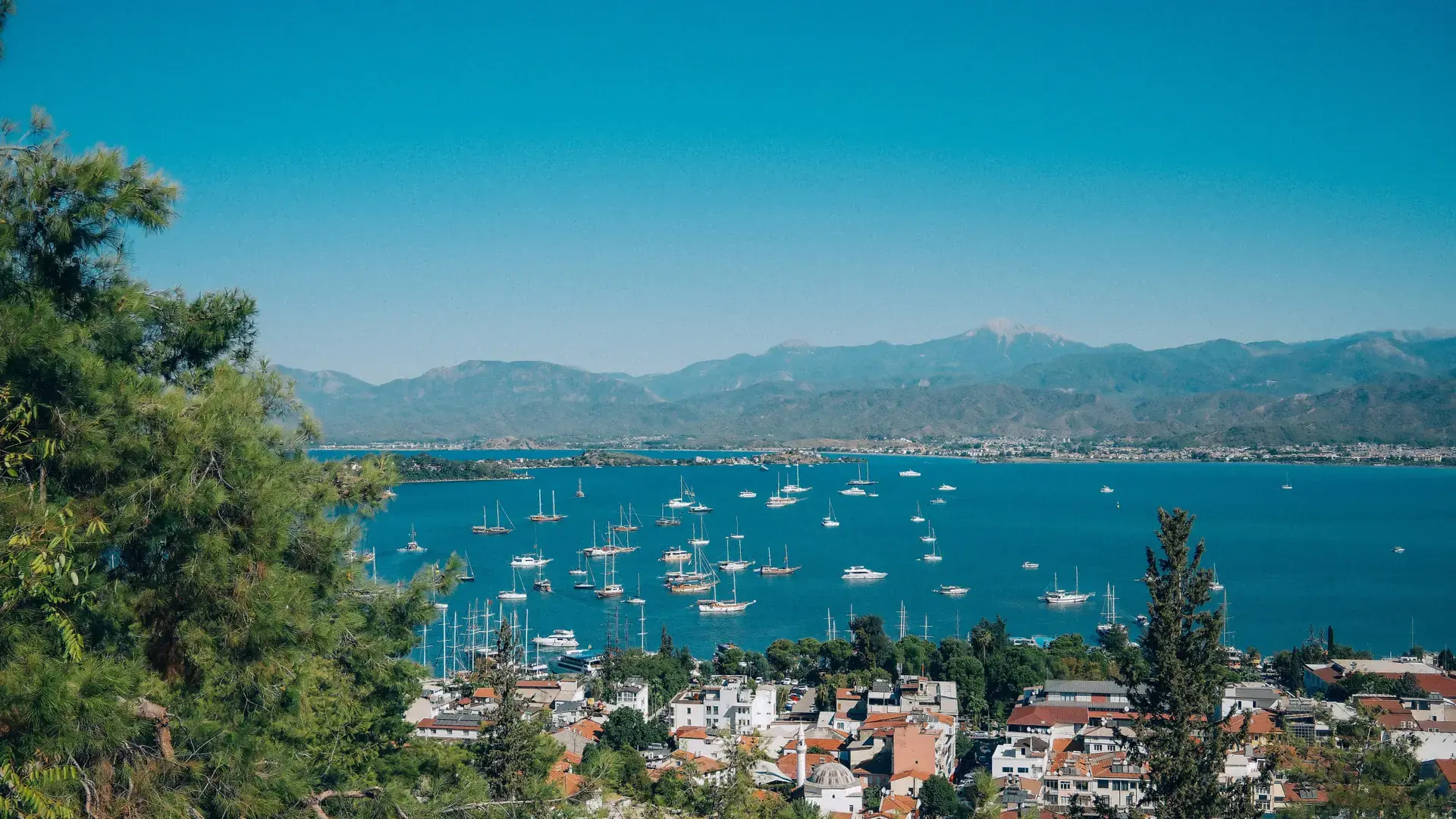 Fethiye harbour and Paspatur waterfront backed by green mountains