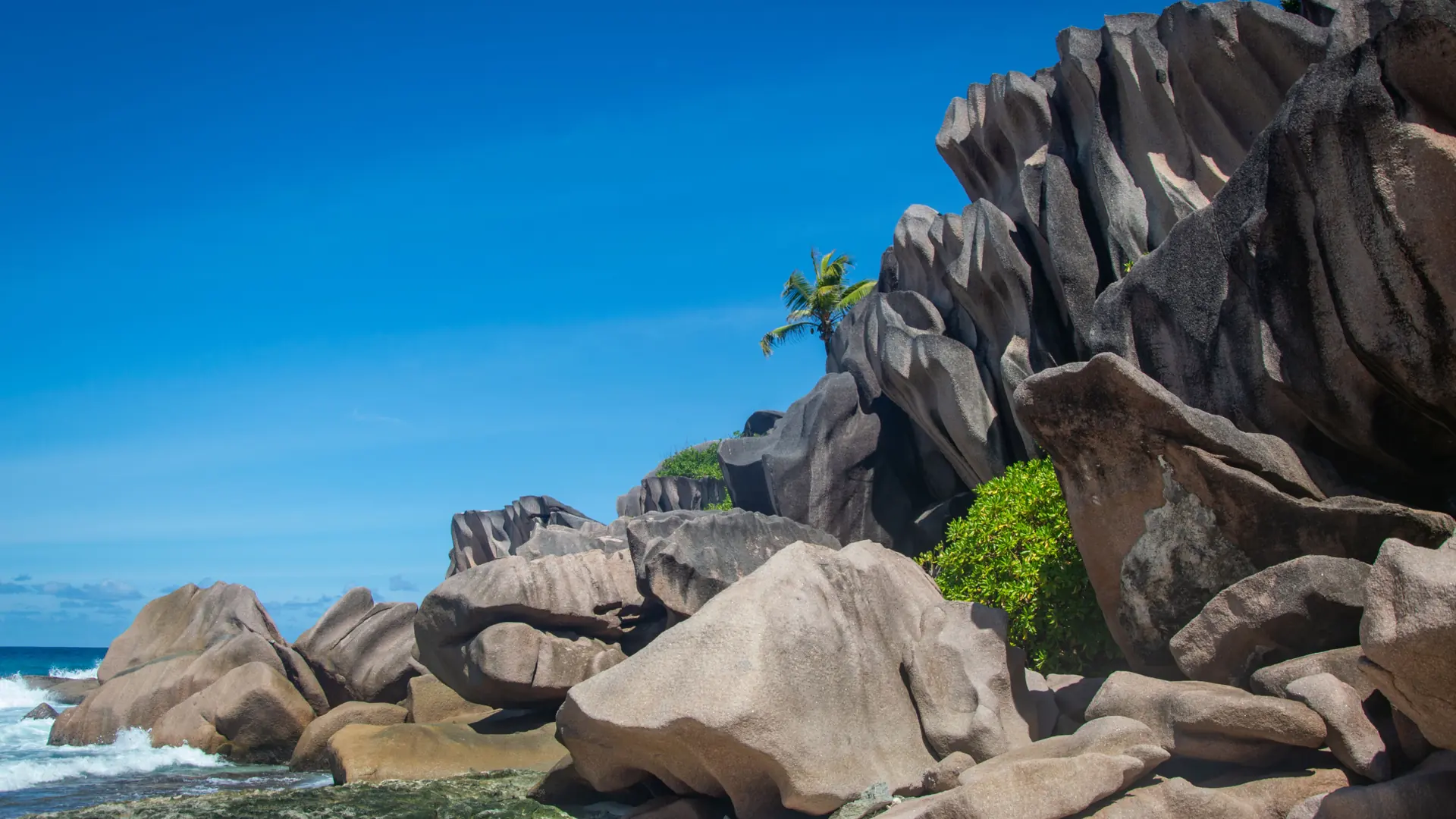 Granite boulders on the sunny shore of La Digue