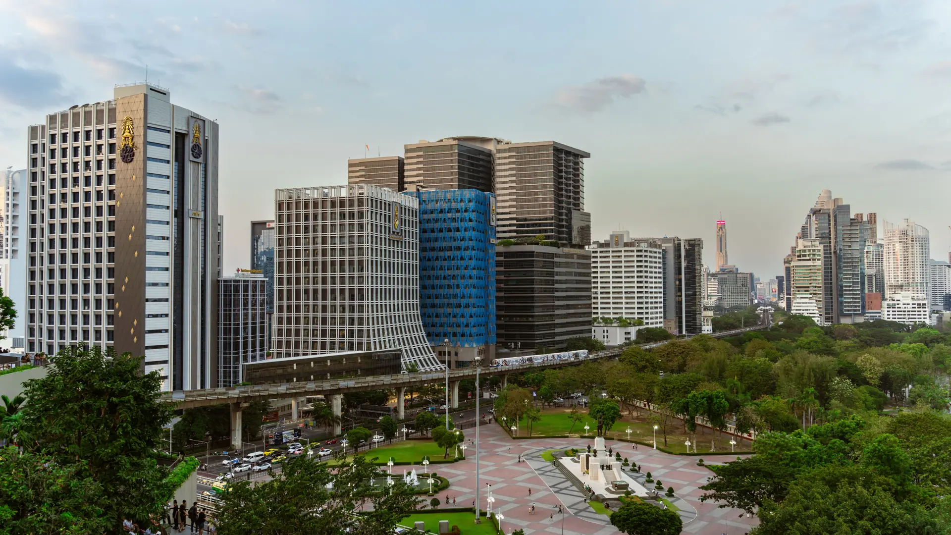 Daylight aerial view across Bangkok's dense business-district skyline