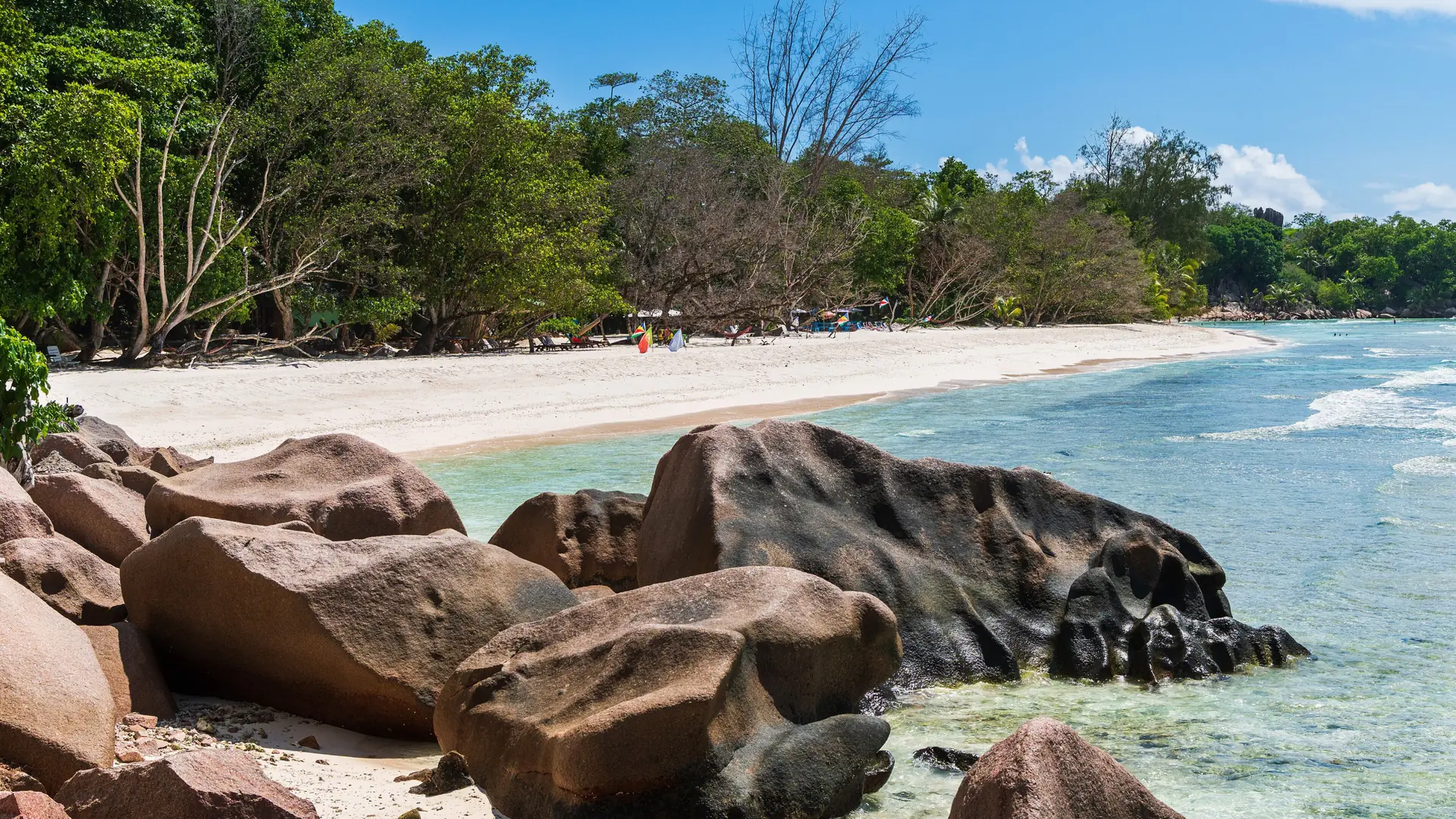 Granite rocks and bright sand at Anse Sévère on La Digue