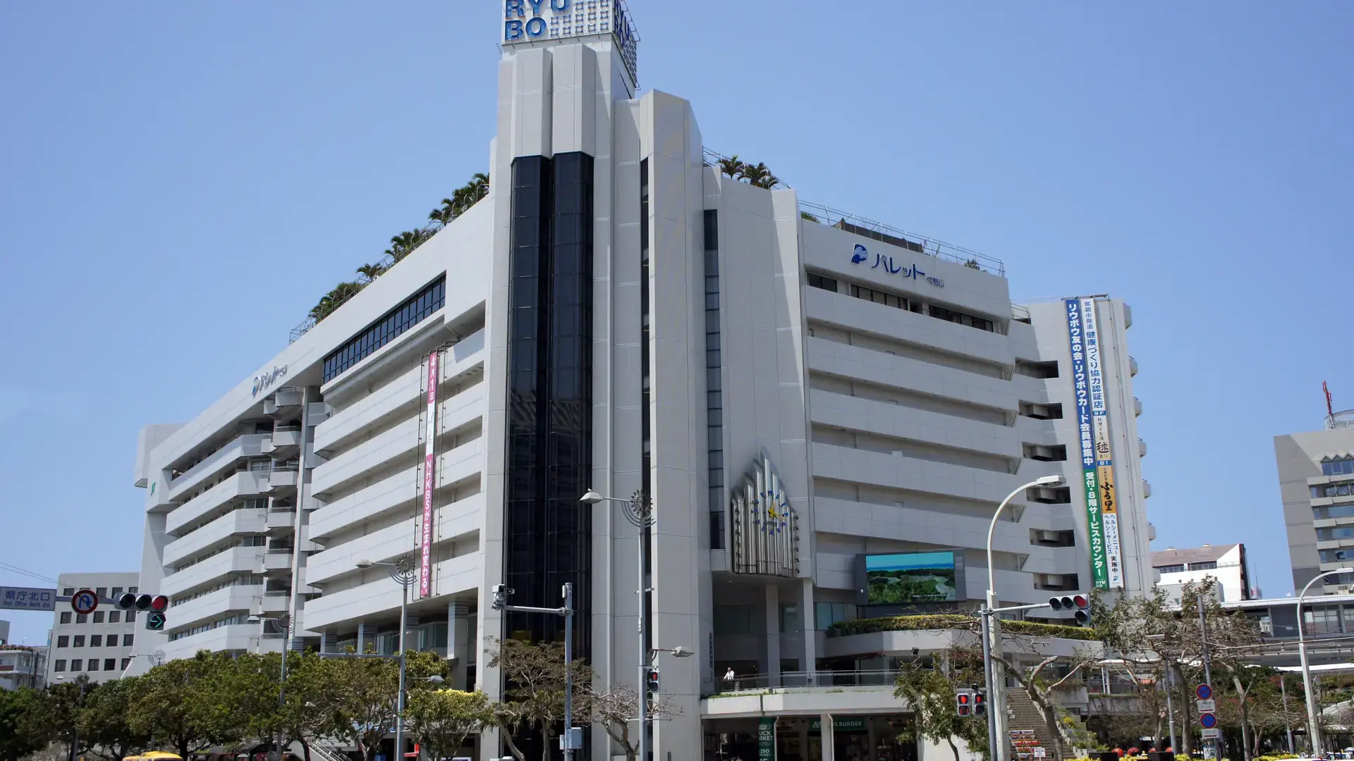 modern Kumoji skyline and Yui Rail crossing central Naha in clear daylight