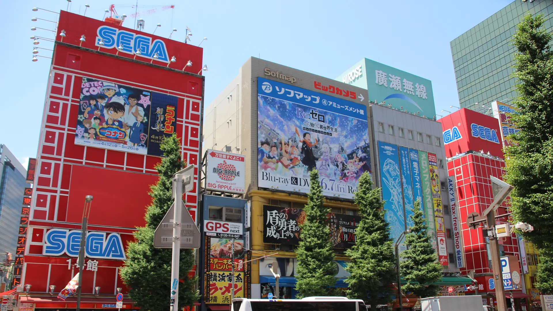 Sunlit electronics and entertainment shopfronts along Chuo-dori in Akihabara.
