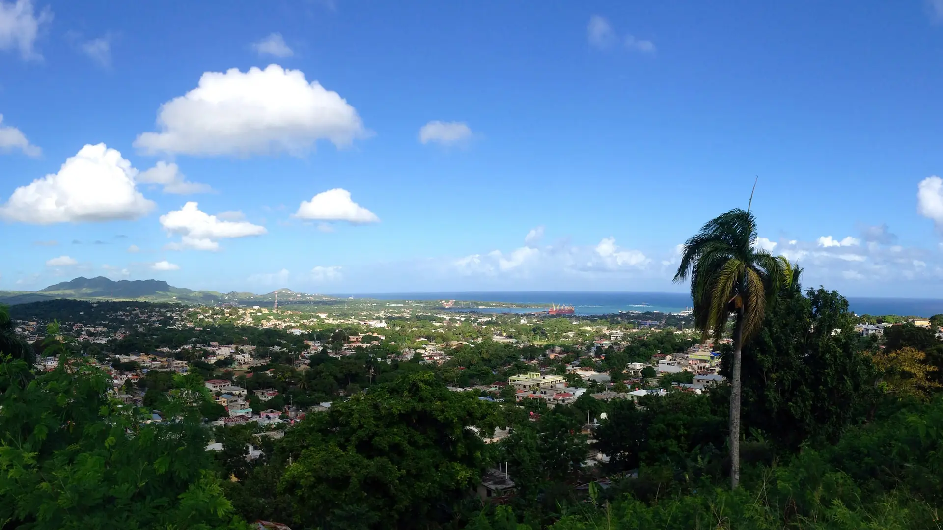 Sunny hilltop view over Puerto Plata city toward the Atlantic