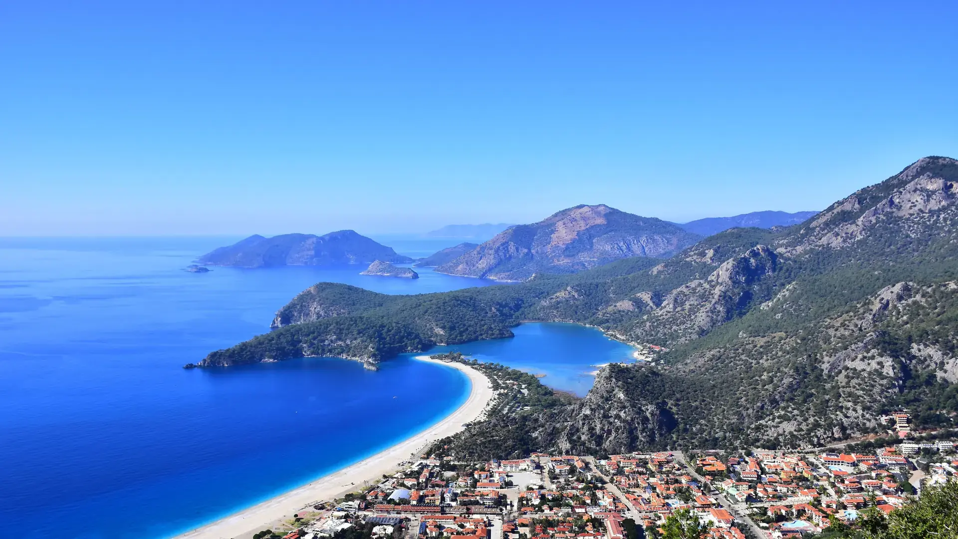 Ölüdeniz blue lagoon and sandy curve seen in brilliant Mediterranean daylight