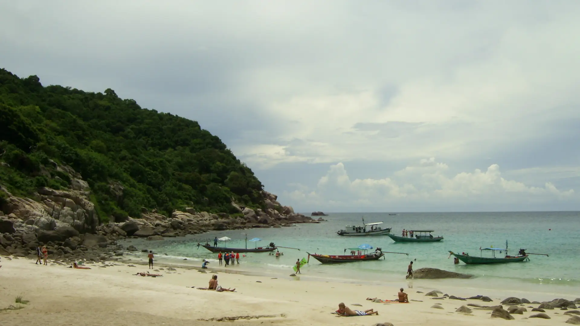 A rocky Koh Tao cove surrounded by lush island vegetation