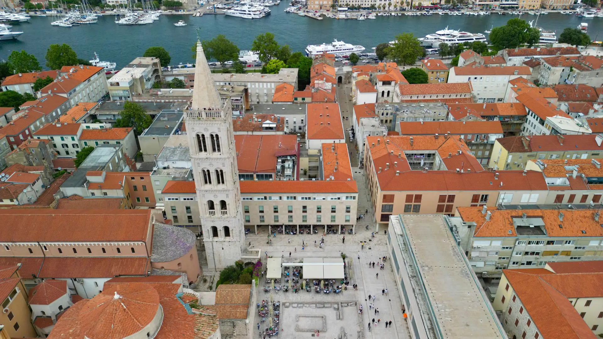 Zadar’s Forum, St Donatus and cathedral bell tower, with the city harbour behind them