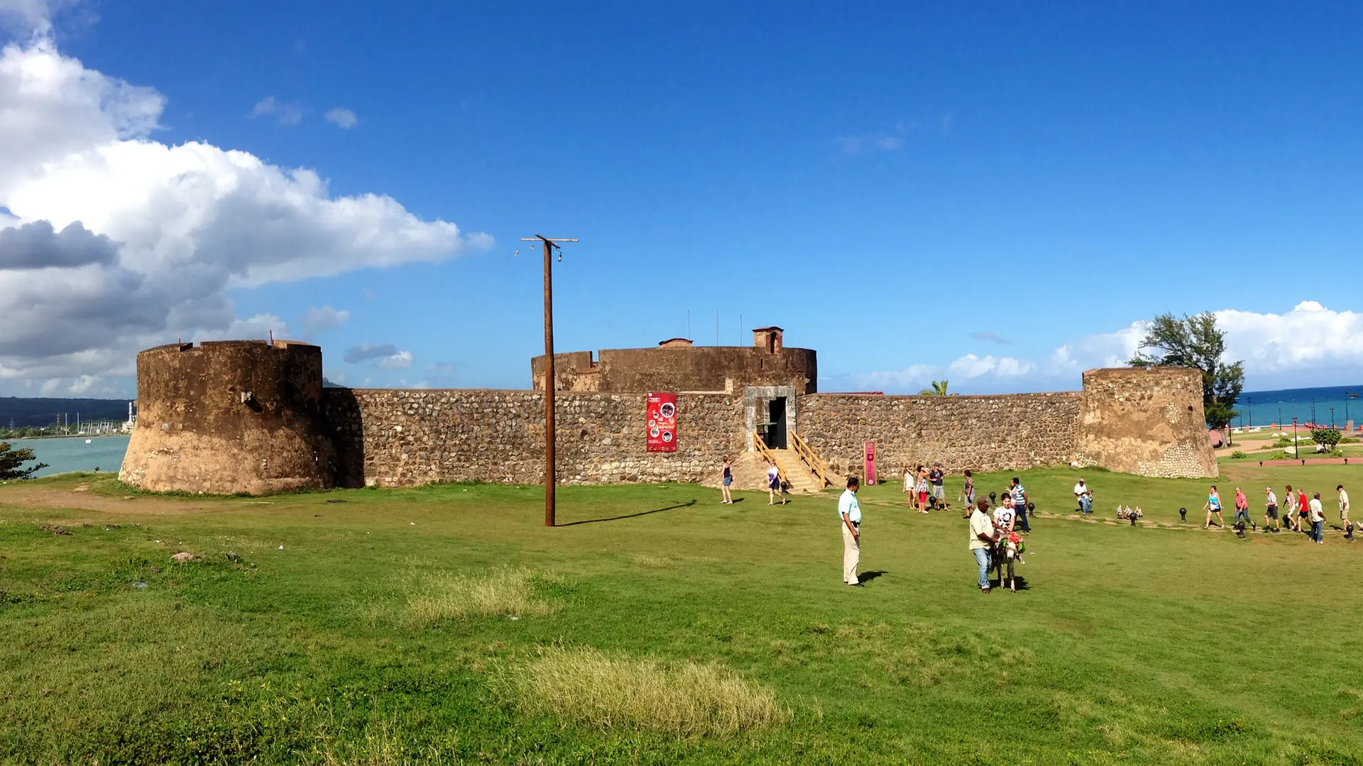 Sunlit Fortaleza San Felipe and lawn in Puerto Plata