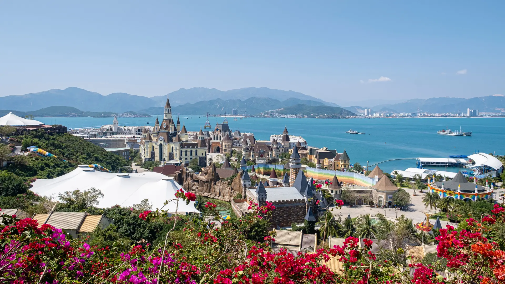 Vinpearl park buildings on Hon Tre with flowers and Nha Trang bay