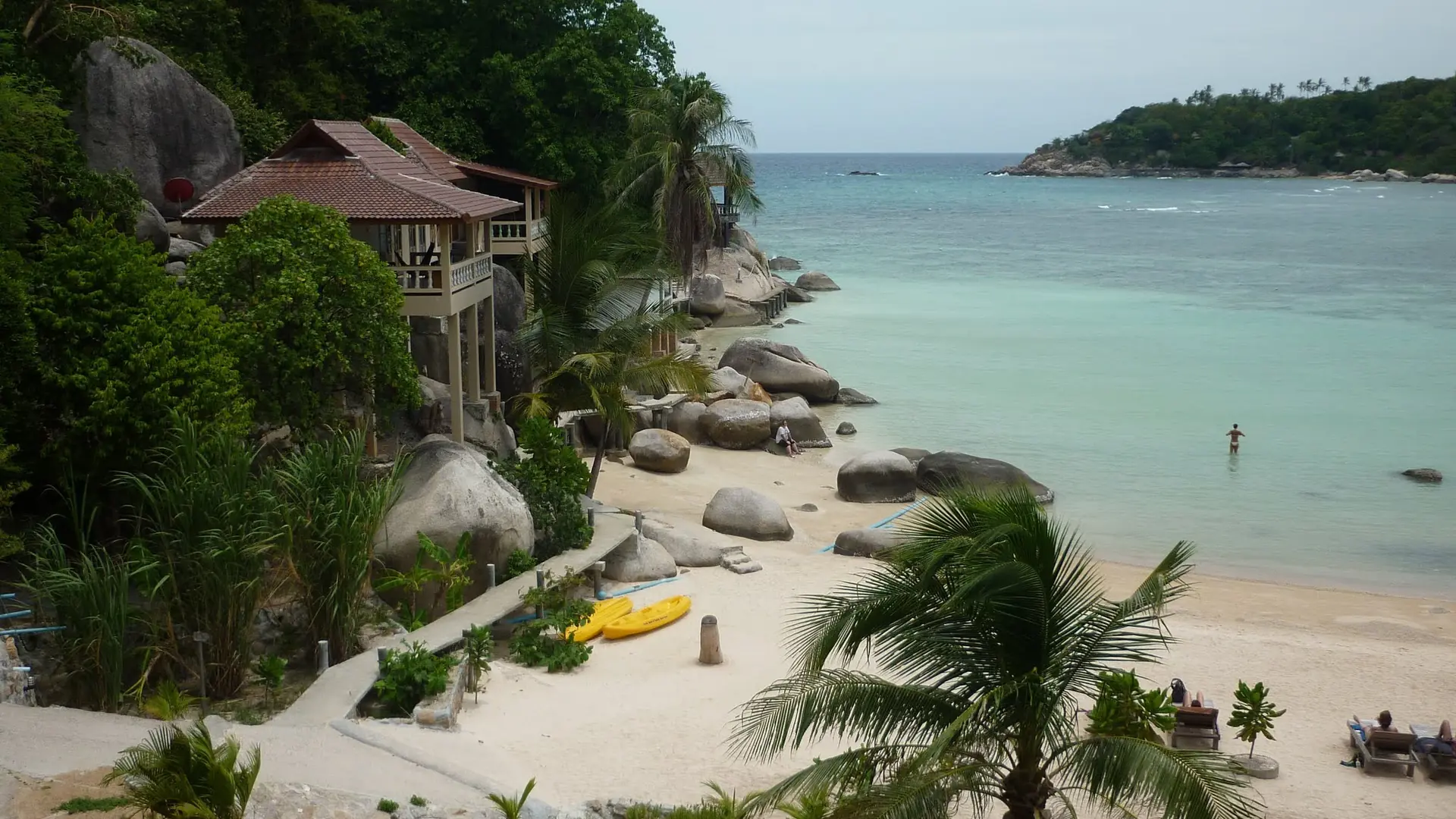 Clear water, granite boulders and wooded slopes around Koh Tao