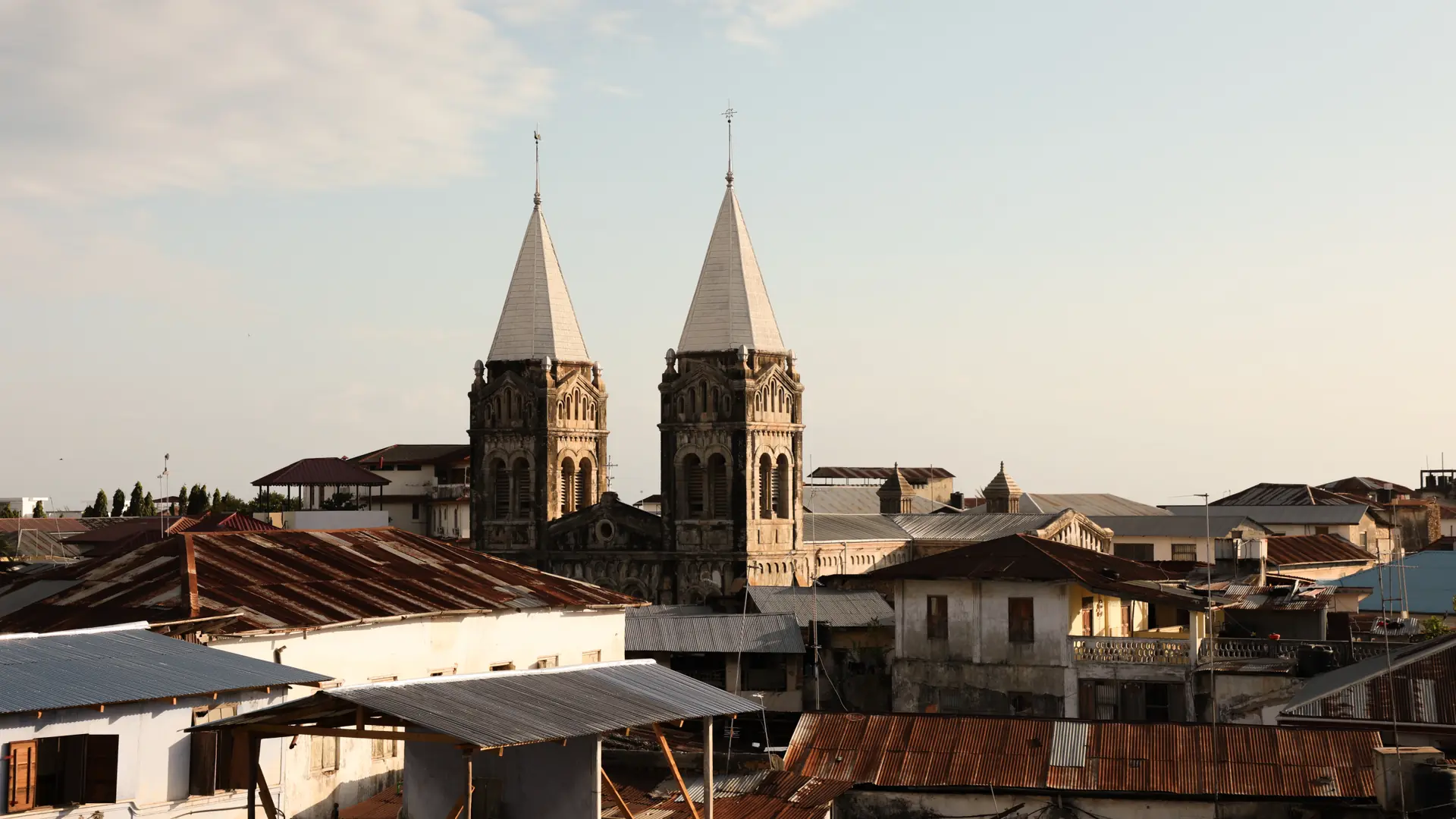St Joseph’s Cathedral rising above Stone Town roofs in daylight