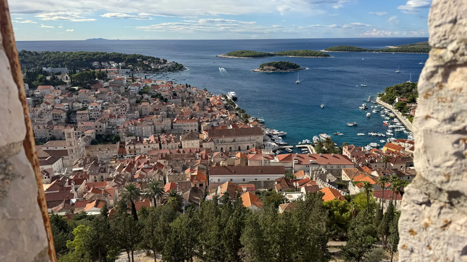 Hvar Town’s red roofs, cathedral and harbour seen from Fortica, with the Pakleni islands beyond.