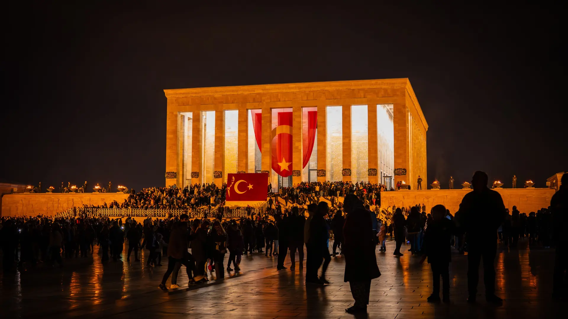 Crowds gathered outside illuminated Anıtkabir in Ankara at night