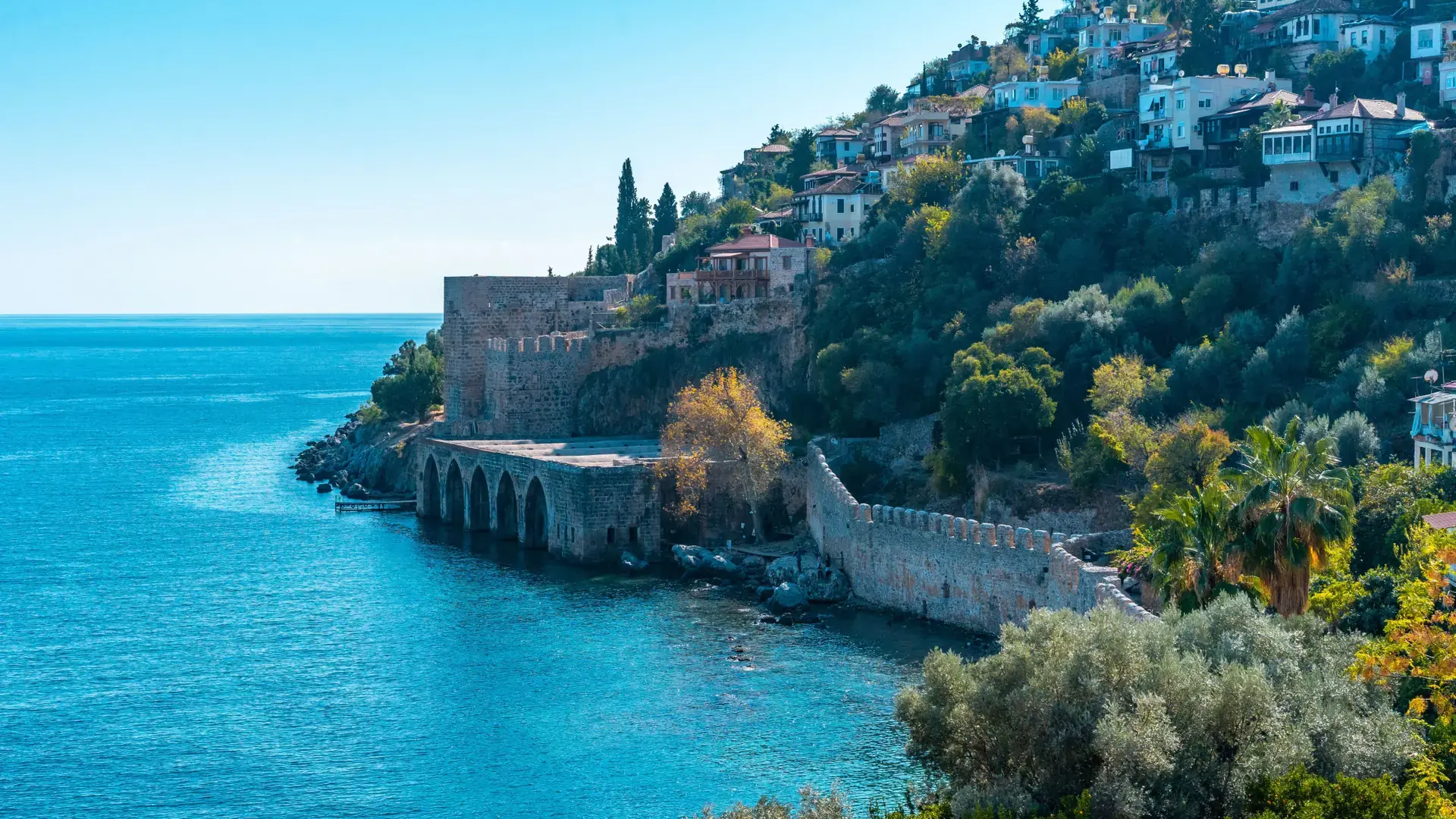 Cleopatra Beach beneath Alanya Castle in bright Mediterranean sun