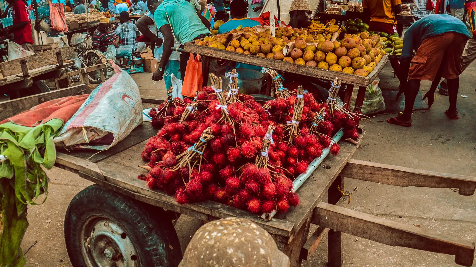 Colourful fruit carts at Zanzibar’s Darajani market in daylight