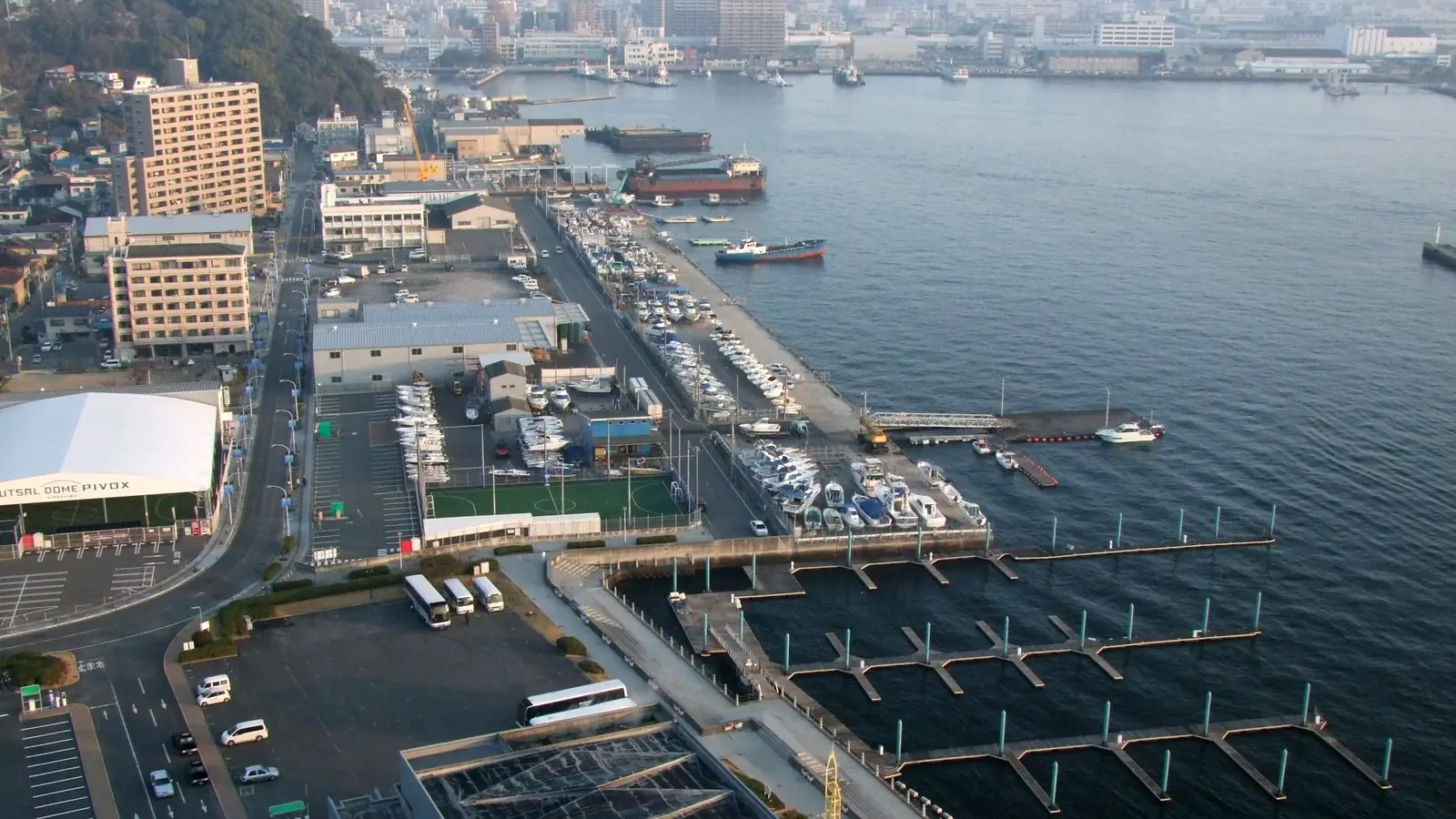 sunlit panorama of Hiroshima Port and blue water around Moto-Ujina