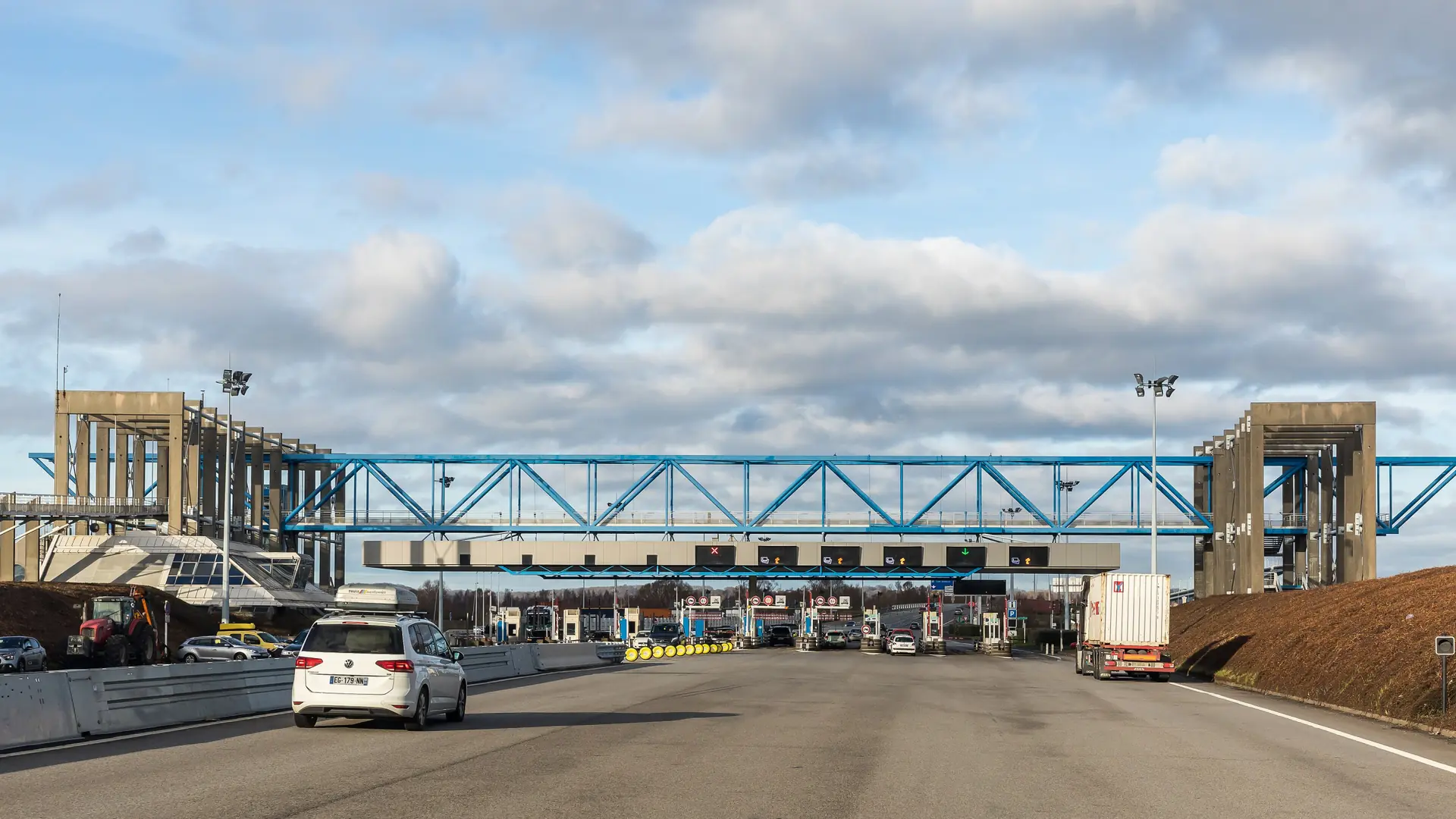 Road approach to the Pont de Normandie toll plaza near Honfleur in daylight