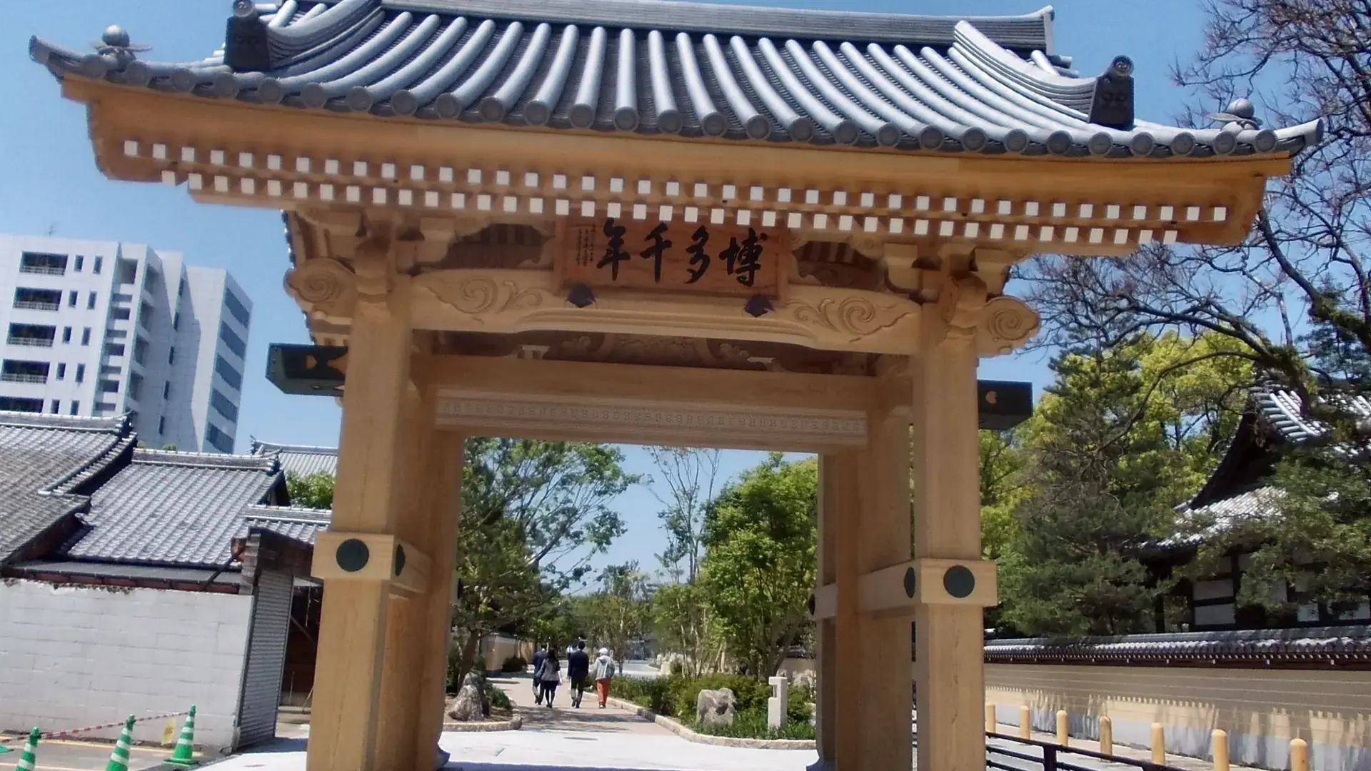 traditional Hakata Old Town gate and temple roofs in warm sunlight