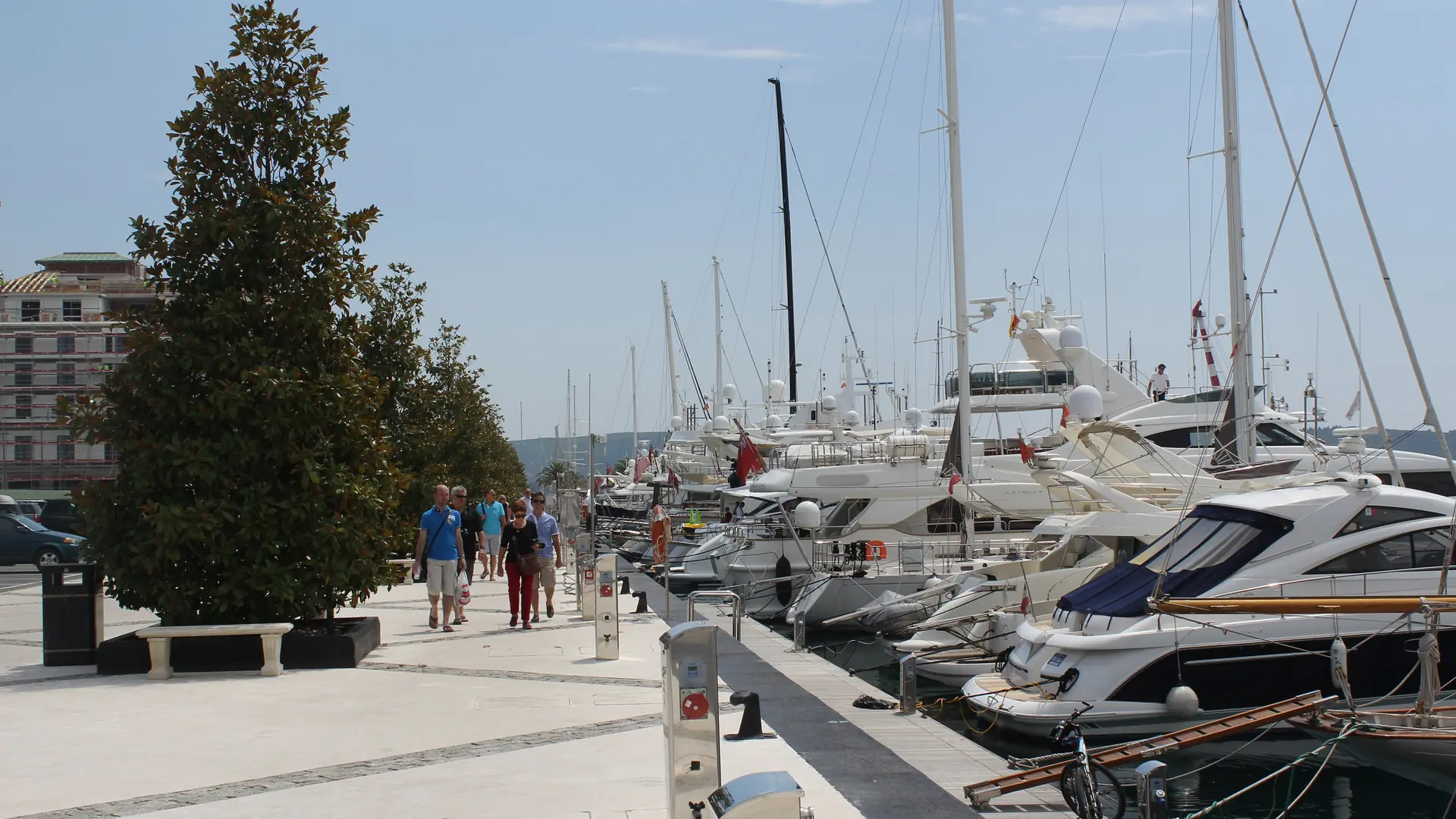 Yachts and a waterside walkway at Porto Montenegro marina in Tivat