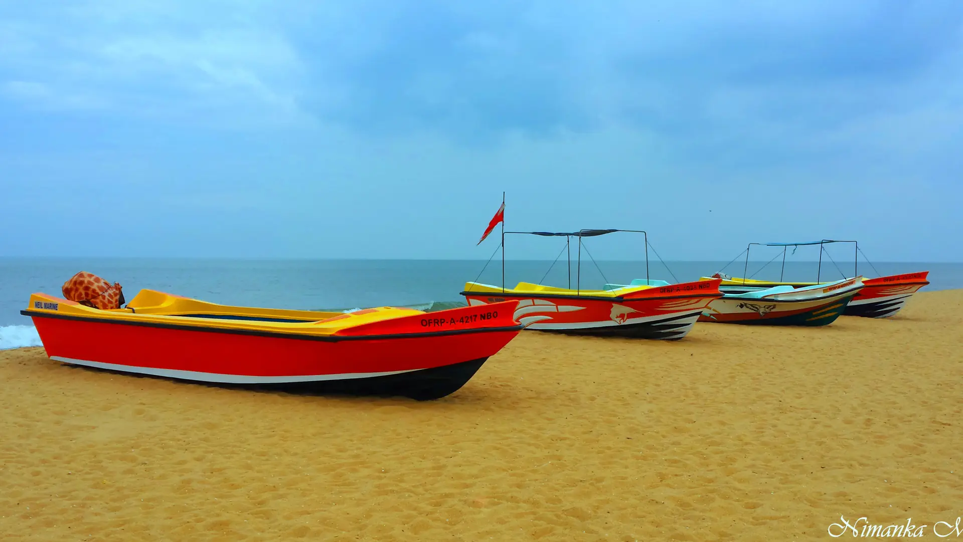 Colourful fishing boats on Browns Beach in Negombo