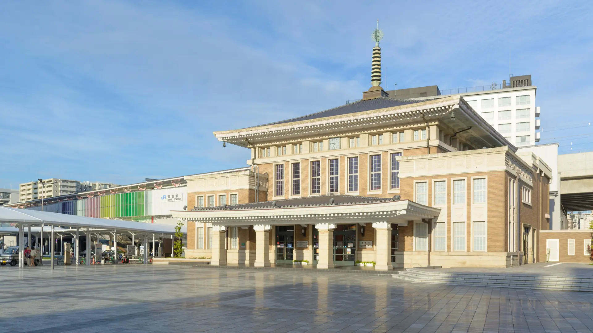 Nara’s former station building beside the modern JR station in sunny daylight
