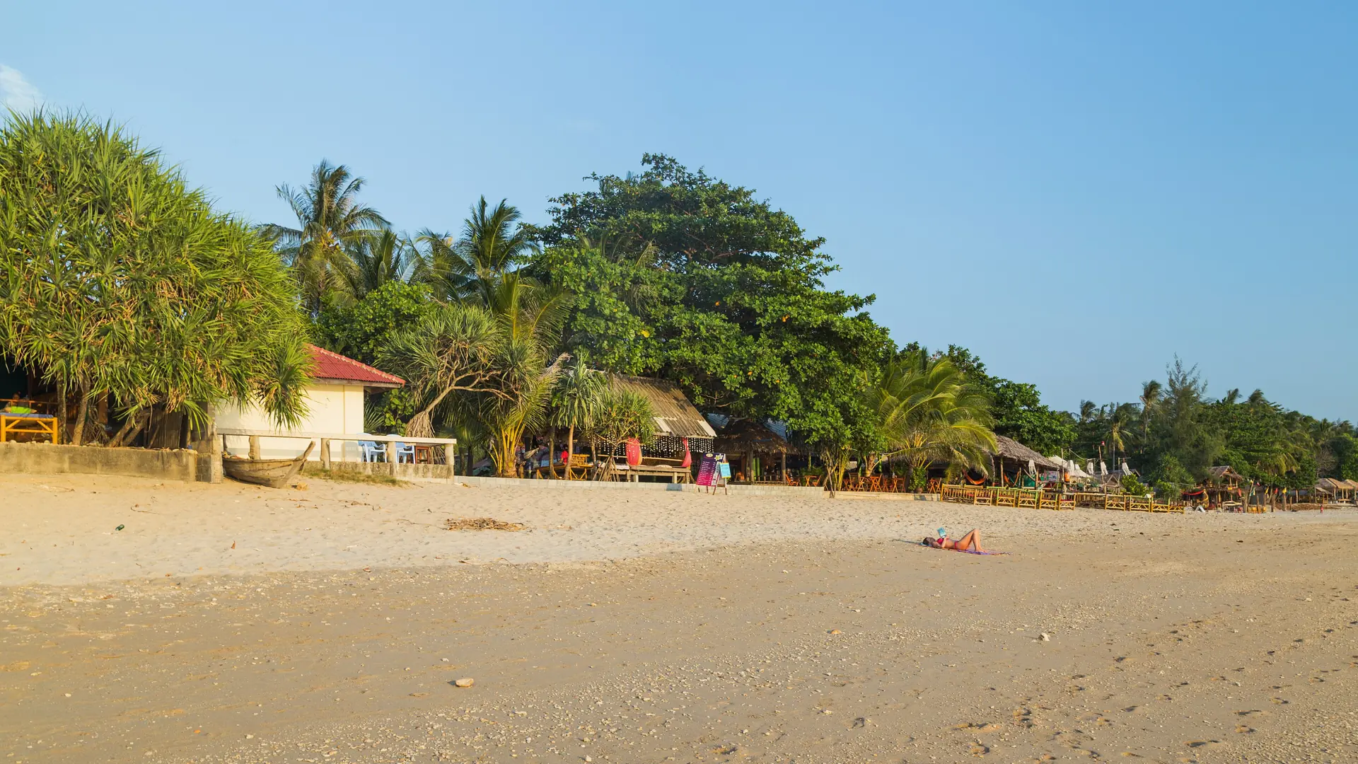 Palm-fringed sand and a quiet Andaman horizon on Koh Lanta