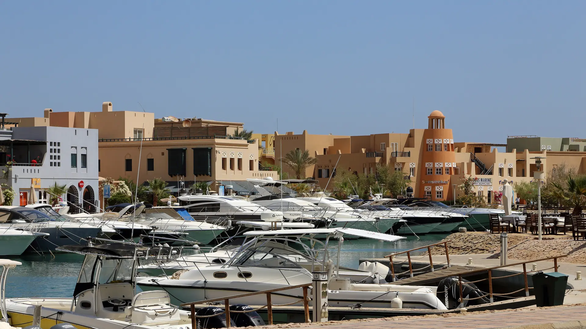 Yachts beside the warm-coloured buildings of Abu Tig Marina, El Gouna