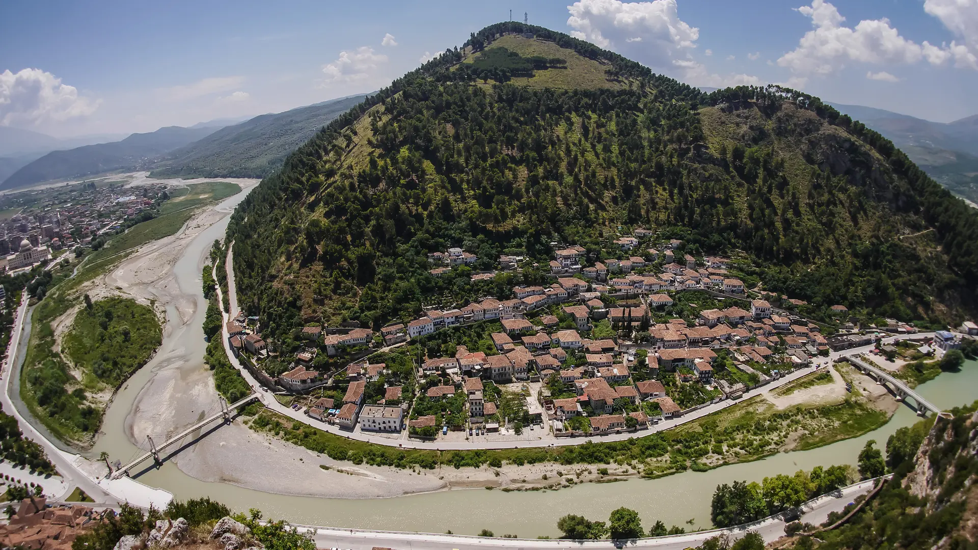 Berat's Gorica side and the curving Osum river seen from above on a sunny day