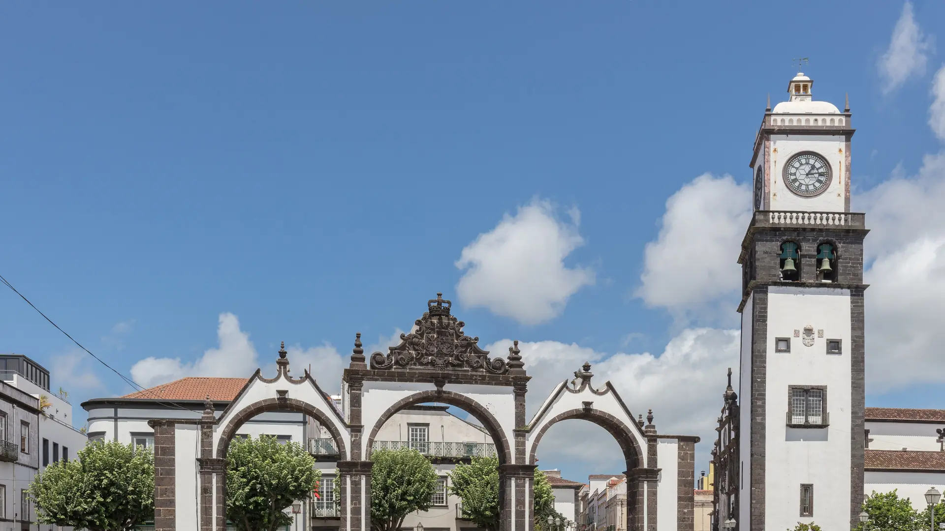 Portas da Cidade’s three basalt arches beside the São Sebastião clock tower in Ponta Delgada