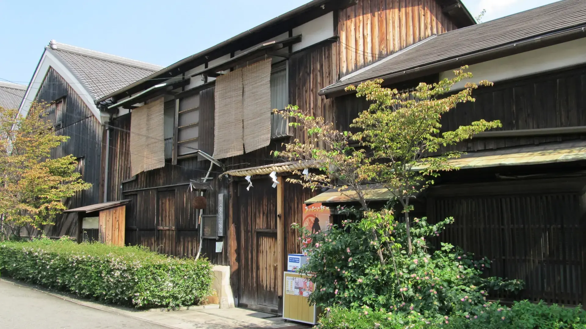 historic wooden Izumi Yunosuke sake brewery in Kobe's sunny Nada district