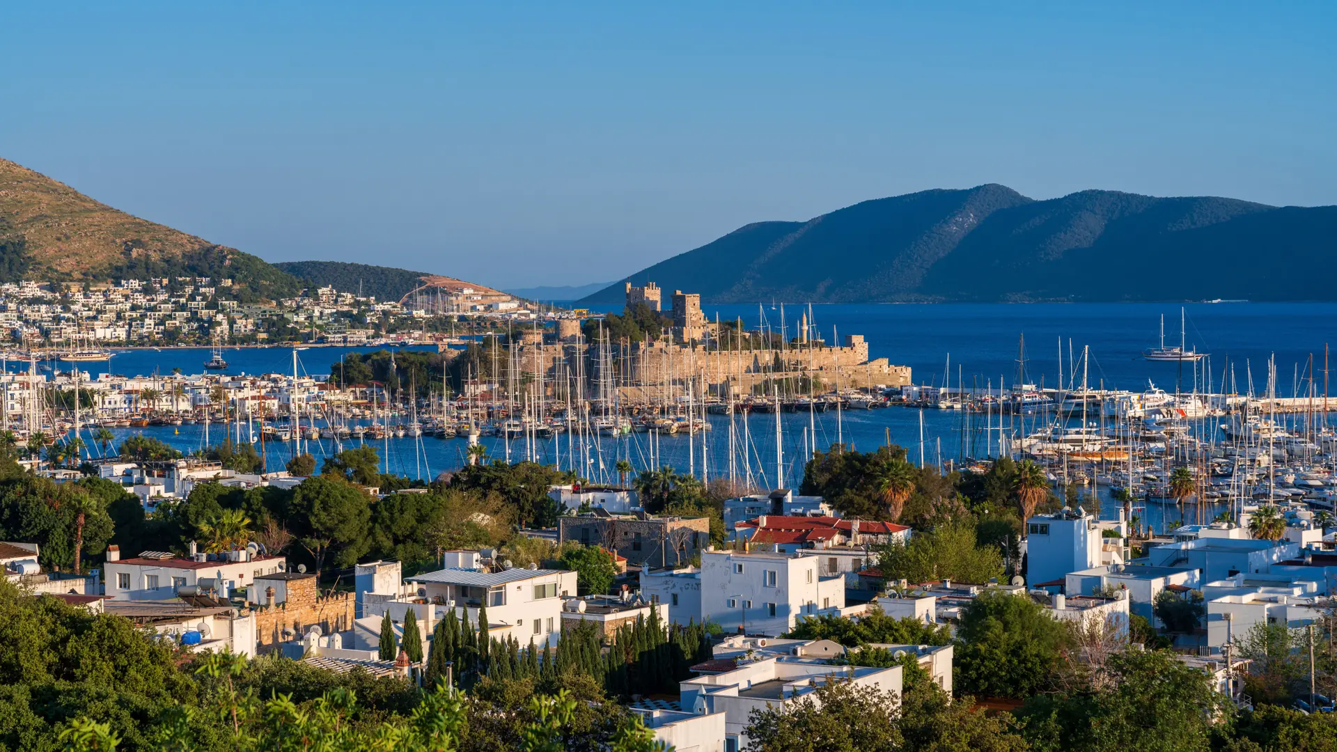 Central Bodrum marina, white hillside houses and blue Aegean water in clear daylight
