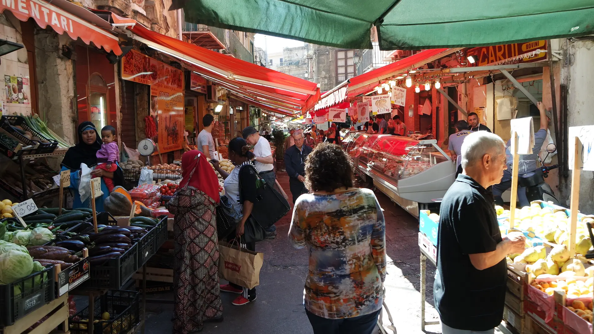 sunlit Palermo market lane with striped awnings, historic stone façades and lively pedestrian scene