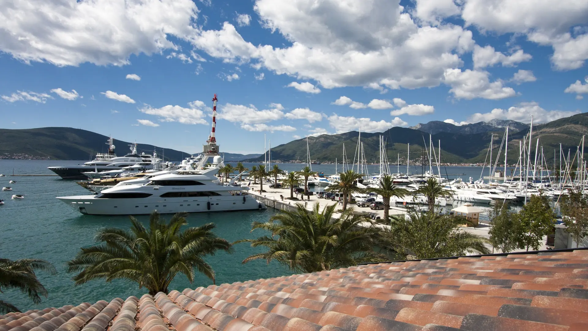 Tivat waterfront and town beside the Bay of Kotor in daylight